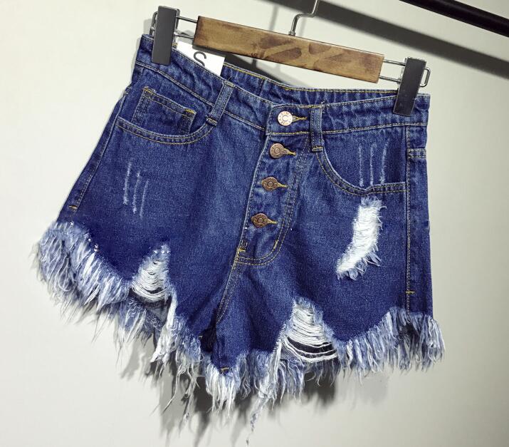 Ellis shorts in high-waisted jeans with rips