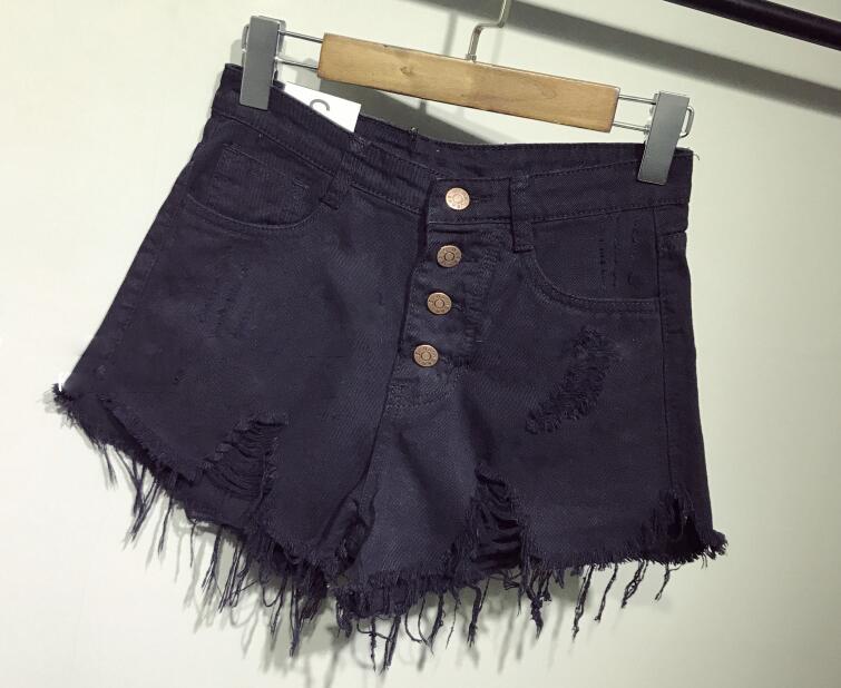 Ellis shorts in high-waisted jeans with rips